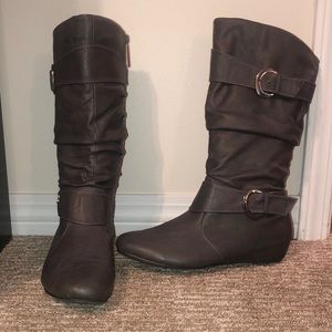 Size 11 boots with buckles.